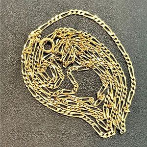 Figaro chain necklace gold tone. Approximately 33 inches.